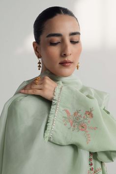 TOP:- Raw SilkBOTTOM:- Raw SilkDUPATTA:- OrganzaOur pastel green silk shirt features floral motifs in block print, embellished with gota work. This handcrafted ensemble is paired with an organza dupatta featuring floral ralli and embroidered accents.Disclaimer: Minor variations in these ensembles are intrinsic to the process of creating handcrafted products and add to their appeal. Art Deco Bedding, Green Silk Shirt, Zara Shahjahan, Gota Work, Organza Dupatta, Green Silk, Pastel Green, Floral Motifs, Silk Shirt