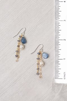 Experience the beauty and craftsmanship of the Seaside Collection with these gorgeous handmade earrings. Mixed Metal (lead and nickel free) Kyanite, Iolite, Pearl 2", with sterling silver ear wires We hand select our natural materials, thus there may be slight variations in color and/or size that will not detract from the overall aesthetic Our unique handcrafted designer jewelry for women is made in America, with each design created individually in our personal design studio in Floyd VA USA Earring Handmade Ideas, Beads Earing Ideas, Diy Jewelry Ideas Homemade, Bridgerton Earrings, Boujee Jewelry, Unique Diy Earrings Ideas, Bridgerton Diy, Bead Earrings Ideas, Jewelry Inspo Earrings