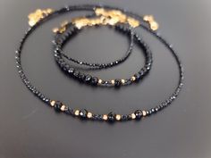 Lovely black set, chocker and 2 bracelets, made of natural black Spinel and Agate. Elegant black necklace made of   black 2mm micro faceted Spinal and natural Agate. Tiny bracelet made with small faceted 2mm Spinel beads. Black Agate bracelet made with 4mm faceted natural Agate beads. You might also like https://www.etsy.com/uk/shop/LoveIuliia?ref=l2-about-shopname§ion_id=42402163 Thank you so much for visiting my shop Iuliia xx Black Faceted Beads Choker, Black Spiritual Jewelry With Faceted Beads, Elegant Handmade Black Beaded Bracelets, Elegant Black Handmade Bracelets, Elegant Handmade Black Bracelets, Black Onyx Choker Jewelry, Black Jewelry With Faceted Beads For Gift, Handmade Black Beaded Bracelets For Parties, Handmade Black Beaded Bracelet For Parties