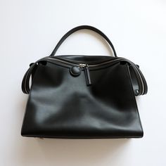 Buy Black Leather Zipper Large Tote Bag With Wide Shoulder Strap Worldwide Free shipping and return, color: Black , material: Genuine Leather Luxury Canvas Tote Hobo Bag, Luxury Coated Canvas Shoulder Bag For Evening, Luxury Casual Shoulder Bag With Branded Hardware, Luxury Shoulder Bag With Handles, Luxury Shoulder Bag With Zipper Closure, Luxury Minimalist Shoulder Bag With Leather Handles, Luxury Chic Canvas Shoulder Bag, Luxury Black Bags With Soft Leather, Luxury Shoulder Bag For Commuting With Zipper Pocket