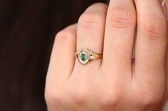 "Emerald Signet Ring in 14k Gold / Baguette Emerald Pinky Ring / Gold Pinky Ring Features *Made to Order. *Gold Kt: 14K *Custom Gold Color: Rose Gold, Yellow Gold, White Gold *Baguette Emerald: 1pcs 4.2x 2.3MM *Total CTW: 0.15ctw *Setting Type: Bezel *Width of Band: Graduates from 7.5MM to 2MM *Center Oval: 10.00mm x 8.5mm *Ready to Ship in 7-10 Business Days Be sure to hit \"favorite\" on the right so it remains on your favorites list and/ or add to your wish list(s). ▶ Want to find out more? C 14k Gold Emerald Cut Signet Promise Ring, 14k Gold Polished Emerald Promise Ring, Fine Jewelry 14k Gold Signet Ring With Gemstone, 14k Gold Signet Ring With Gemstone, Timeless 14k Gold Baguette Cut Emerald Ring, Art Deco Baguette Cut Gemstone Ring, Heirloom Emerald Baguette Cut Ring, Fine Jewelry 14k Gold Baguette Cut Signet Ring, 14k Gold Baguette Cut Signet Ring