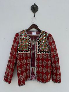 Repurposed kantha jacket with tribal mirrorwork patch Kantha Jacket Outfit, Festive Outerwear With Woven Motifs, Red Folk Cotton Outerwear, Fitted Outerwear With Mirror Work For Festivals, Traditional Festival Outerwear With Mirror Work, Traditional Long Sleeve Outerwear With Mirror Work, Festive Long Sleeve Outerwear With Mirror Work, Fitted Cotton Outerwear For Festivals, Folk Style Patchwork Outerwear For Festivals