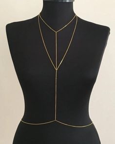 Elevate your style with this handmade, minimalist body chain designed to add a touch of elegance to any outfit. Whether you're dressing up for a special occasion or want to enhance your everyday look, this body chain is versatile enough to complement any wardrobe. Handcrafted with Care: Each piece is meticulously made to ensure quality and durability, using lightweight yet sturdy materials for a comfortable fit. Minimalist Design: A simple yet stylish chain that wraps effortlessly around your bo Adjustable Gold Body Chain For Summer, Summer Body Chain With Adjustable Chain As A Gift, Adjustable Body Chain As Summer Gift, Dainty Gold Body Chain For Party, Minimalist Lariat Necklace With Adjustable Chain For Party, Minimalist Gold Body Jewelry For Party, Elegant Delicate Chain Lariat Body Jewelry, Gold Dainty Body Jewelry For Party, Delicate Gold Body Jewelry For Party