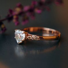 a close up of a diamond ring on a table