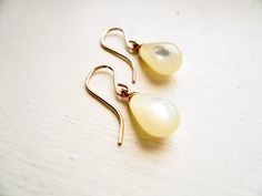 "Mother of Pearl Earrings. Dainty gold bridal jewelry. Tear Drop Pearl Earrings. June birthday birthstone gift. Vintage Limited Edition Timeless earrings for everyday, but special enough for a big day. Vintage mother of pearl (shell) teardrops with gold loops are suspended from high quality gold filled ear wires. Simple and classic. These drops are vintage, as such these earrings are a limited edition. These earrings measure just under 1\" (24mm) from the top of the ear wire's curve to the botto Yellow Gold Drop Bridal Earrings As Gift, Gold Teardrop Pearl Earrings For Gift, Gold Teardrop Pearl Earrings As A Gift, Gold Hypoallergenic Pearl Earrings For Gifts, Gold Birthstone Earrings For Wedding, Yellow Gold Bridal Earrings As Gift, Gold Nickel-free Teardrop Earrings For Anniversary, Rose Gold Drop Pearl Earrings Gift, Rose Gold Teardrop Pearl Earrings As Gift