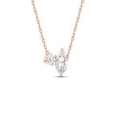 The subtle yet eye-catching sparkle of this necklace makes it suitable for any attire and event.. This chic diamond necklace showcases a pendant designed with two stones, a round and marquise diamond, set next to each other. The necklace's effortless elegance and refined aesthetic make it an excellent choice for those who wish to add a hint of glamour to their everyday look. Rose Gold Marquise Diamond Necklace, Luxury Marquise Necklace With Single Diamond, Luxury Single Diamond Marquise Necklaces, Rose Gold Marquise Necklace Fine Jewelry, Formal Marquise Necklace With Diamond Accents, Formal Marquise Necklaces With Diamond Accents, Luxury Marquise Single Diamond Necklace, Formal Rose Gold Marquise Necklace, Elegant Diamond Necklace With Diamond Eyes For Anniversary