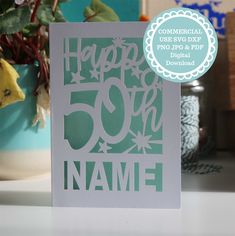 a greeting card with the words happy 50th on it and a flower pot in the background