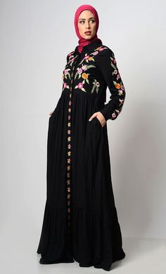 A perfect wardrobe piece for elegant style Simple and classy details A stylish abaya with hidden button down placket An abaya with embroidered front yoke, sleeves and placket Includes both side pockets Shirt Collar Loose belt included Full Sleeves with cuff FABRIC: Rayon CARE: Gentle Hand wash and drying Elegant Black Abaya With Floral Embroidery, Embroidered Modest Maxi Abaya, Modest Embroidered Maxi Abaya, Spring Long Abaya With Floral Embroidery, Spring Abaya With Floral Embroidery, Spring Floral Embroidered Long Abaya, Spring Floral Embroidered Abaya, Black Long Sleeve Abaya With Floral Embroidery, Black Abaya With Floral Embroidery