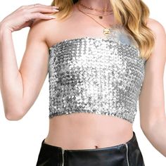 Unleash your inner sparkling diva with the Anna-Kaci Women's Strapless Glitter Sequin Sparkle Bandeau. This tube top is adorned with all-over sequin embellishments, offering a dazzling display of shimmer and shine. Its crop length and stretch fit ensure comfort and style all night long. Trendy Bandeau Party Top, Trendy Bandeau Top For Party, Glamorous Strapless Sequin Fabric For Summer, Glamorous Bandeau Crop Top For Club, Glamorous Bandeau Crop Top For Night Out, Glamorous Strapless Crop Top For Club, Glamorous Bandeau Crop Top For Spring, Metallic Sequin Crop Top For Party Season, Glamorous Silver Strapless Tube Top