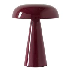 a red table lamp on a white background