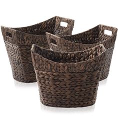 four brown woven baskets sitting next to each other