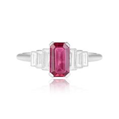 An elegant ring featuring an elongated emerald-cut natural red ruby center weighing 1.13 carats. Flanking the prong-set ruby center are three baguette-cut diamonds on each side that are bezel-set. The total weight of these diamonds is approximately 0.28 carats. This ring is handcrafted in platinum.
The measurements of this ruby center are approximately 7.58mm x 4.29mm x 2.82mm.
This ring is currently sized at 6.5 and can be resized at no extra cost.
Ready to Make It Yours? Contact us to reserve Luxury Ruby Ring With Vvs Clarity And Emerald Cut, Luxury Ruby Ring With Emerald Cut Center Stone, Luxury Emerald Cut Ruby Ring With Vvs Clarity, Luxury Emerald Cut Ruby Ring With Center Stone, Luxury Rectangular Ruby Ring For Wedding, Formal Rectangular Ruby Ring, Classic Emerald Cut Diamond Ruby Ring, Red Ruby Ring With Vvs Clarity And Baguette Cut, Classic Ruby Ring With Radiant Cut