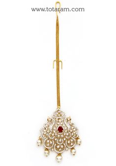 18 Karat Gold "Detachable - Peacock" Diamond Maang Tikka cum Pendant - Papidi Billa with Color Stones & South Sea Pearls
  This Product can be used as pendant.
  This product has Inter Changeable Stones in the pendant. 
  Gross Weight of the Pendant without Chain : 12.300 Grams
  Gross Weight of the Chain without Pendant : 1.950 Grams
  Length of the Pendant : 2.15 inches
  Width of the Pendant :  1.25 inches
 - 235-GT477 - in 14.250 Grams for USD $2,903.54 USD. 
Made in India by Totaram Jeweler Luxury Bollywood Pendant Jewelry, Luxury Gold Tikka With Stone Work, Luxury Tikka With Stone Work For Reception, Festive Bridal Necklace In 22k Gold With Peacock Design, Festive 22k Gold Bridal Necklace With Peacock Design, Festive Yellow Gold Kundan Necklace With Peacock Design, 22k Gold Bridal Necklace With Peacock Design, Gold Kundan Bridal Necklace With Peacock Design, 22k Gold Kundan Necklace With Peacock Design For Wedding