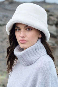 Warm up in an instant with the Shearling Sheepskin Bucket Hat—lending a heaven-sent texture to a timeless style. This hat’s plush Spanish sheepskin mouton exterior effortlessly elevates your winter look while keeping you snug and warm. Boasting a flared brim that hugs your face in velvety softness, this charming and cozy hat will shield you from the elements all day and right into the evening. Finished with a poly satin lining. Crochet Winter Hats, Fur Hats, Hats Women, Brim Hats, Sheepskin Coat, Cozy Hat, Cold Weather Fashion, Western Hats, Beautiful Hats