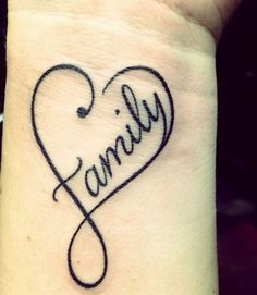 a tattoo on the wrist that says family with a heart in the center and an intertwined