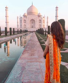 a woman standing in front of a taj mahal, india photo taken on her instagram