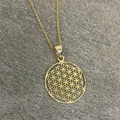 Compelling handmade solid gold round shaped Flower of Life spiritual pendant Absolutely REAL GOLD will not tarnish or rust Finely handcrafted genuine 14 karat gold in stunning polished finish Pendant Weight: 0.8 grams Pendant with 16 inch chain weight: 1.9 grams Pendant with 18 inch chain weight: 2 grams Pendant with 20 inch chain weight: 2.1 grams Pendant with 22 inch chain weight: 2.2 grams Pendant Height: 0.90 inch (with bail)  Pendant Width: 0.65 inch  Pendant Depth: 0.02 inch  Chain Width: Spiritual Round Gold Plated Jewelry, Symbolic Yellow Gold Jewelry With Round Pendant, Symbolic Round Tarnish Resistant Necklace, Nickel Free Yellow Gold Pendant Necklace, Gold Circular Jewelry With Polished Finish, Symbolic Round Hallmarked Necklace, Spiritual Gold Plated Round Jewelry, Gold Circular 14k Gold Necklace, Nickel Free Yellow Gold Flower Pendant Jewelry