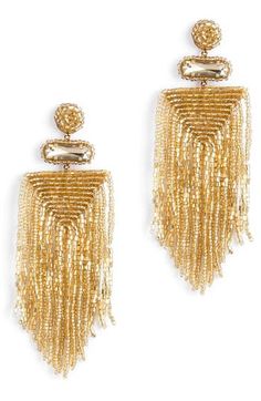 Designed to swish and sway right above the shoulders, these dramatic tassel earrings are handcrafted with shimmery beads and sparkly stone accents. 4" drop; 1/14" width Handmade Brass/glass/enamel/faux leather Imported Wakanda Party, Long Seed Bead Earrings, Deepa Gurnani, Light Weight Jewelry, Beaded Tassel Earrings, Handmade Earrings Beaded, Tassel Drop Earrings, Earrings Design, Handmade Brass