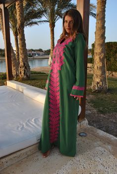 A stunning embroidered Kaftan dress that is elegant, colorful, and unique! The dress is made of Egyptian cotton that has a soft feel to it so you will surely feel comfortable and royal in it. It also comes with a small invisible pocket on the right side of the Kaftan for added practicality. You can wear this Kaftan practically anywhere and for any occasion. You can dress it up with a pair of heels and strut like an Egyptian queen in any gathering, resort, or party. Or you can dress it down with Traditional Green V-neck Tunic, Green Tunic For Eid, Green Kurta With Embroidered Neckline For Eid, Green Long Sleeve Kurta With Embroidered Border, Traditional Green Kurta With Embroidered Neckline, Bohemian Kaftan With Embroidered Long Sleeves, Green Embroidered Neckline Dress For Eid, Green Tunic Dress With Resham Embroidery, Traditional Green Long Sleeve Maxi Dress