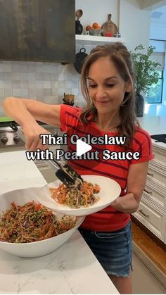 a woman cutting up food in a bowl on top of a kitchen counter with the words thai glasaw with peanut sauce