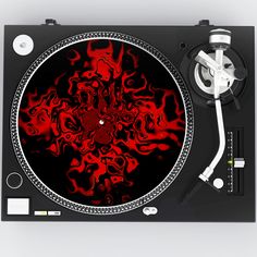 a turntable with red and black designs on it