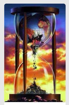 an hourglass with the earth in it on top of a purple and blue background