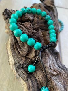 Beautiful Pine Stone bracelets. Smallest adjusted size -14cm circumference. Offered In 2 colors-teal/ darker turquoise and light turquoise. Personalisation is optional-stainless steel initials (in the picture). Gift Wrapping available for additional $1.85 Please click here: https://www.etsy.com/listing/1345522559/gift-wrapping-options?ref=listing_published_alert Adjustable Turquoise Beaded Round Bracelet, Adjustable Turquoise Hand-strung Beaded Bracelets, Adjustable Hand-strung Turquoise Beaded Bracelets, Casual Turquoise Beaded Adjustable Bracelets, Casual Turquoise Adjustable Beaded Bracelets, Green Bracelets With Adjustable Round Beads, Green Bracelets With Adjustable Length And Round Beads, Adjustable Hand-strung Turquoise Bracelets, Adjustable Round Friendship Bracelets