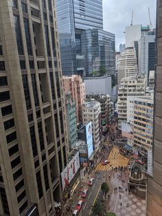 a city street filled with lots of tall buildings