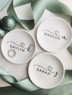 three personalized dishes with names on them