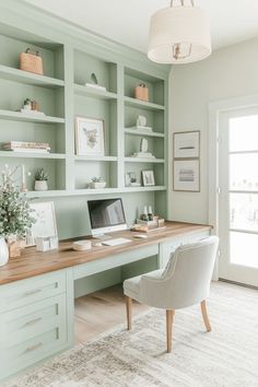 a home office with green walls and built - in shelving