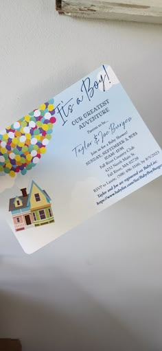 a house with balloons attached to it's front and back side on a card