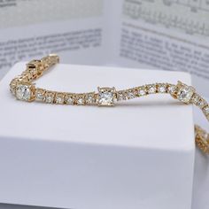 Elegant 7.00CT (G-H in color & VS1-VS2 in clarity) Cushion and Round Cut Diamond Tennis Bracelet in 14KT Yellow Gold 4.30 Carat:8 cushion cut diamonds weighing 4.30 carat2.70 Carat: 48 round cut diamonds weighing 2.70 caratTreat yourself with our 7.00ct cushion and round cut diamond - diamond tennis bracelet MDL#PSBR1052. At Primestyle.com, we deal ONLY with 100% real, natural and conflict free diamonds. Our diamonds are NOT enhanced NOR treated. Shine with casual glamour with Primestyle diamond Classic Rectangular Diamond Bracelet With Brilliant Cut, Classic Rectangular Brilliant Cut Diamond Bracelet, Classic Brilliant Cut Diamond Bracelet, Diamond Tennis Bracelet For Wedding, Formal Rectangular Diamond Tennis Bracelet, Rectangular Diamond Bracelet For Anniversary, Rectangular Diamond Cut Bracelet For Wedding, Rectangular Diamond Cut Wedding Bracelet, Rectangular Diamond Tennis Bracelet With Accents