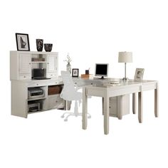 a white desk with two computers on it