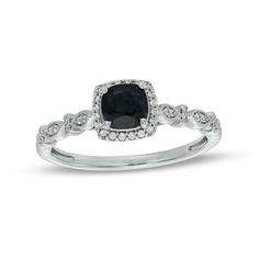 A charming look of love, this vintage-inspired gemstone and diamond engagement ring is sure to win her heart. Crafted in cool 10K white gold, this choice showcases a 5.0mm cushion-cut rich black sapphire embraced by a frame of shimmering diamonds. Along the Art Deco-style shank, pairs of diamonds in milgrain-lined marquise shapes alternate with stacked diamond duos. Radiant with 1/10 ct. t.w. of diamonds and a bright polished shine, this engagement ring is the start of something beautiful. Look Of Love, Ring Pop, Vintage Style Engagement Rings, Cute Engagement Rings, Diamond Stacks, Diamond Frame, Black Sapphire, Frame Art, Sapphire Stone