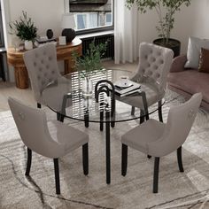 This 5 piece round tempered galss dining room set can effortlessly blend in various decor styles, including modern, farmhouse, and traditional. It is perfect for the dining room, kitchen, restaurant, living room and more. Lark Manor™ Chair Color: Gray | Lark Manor™ 5-Piece Round Glass Dining Table Set Upholstered / Metal in Gray | 4 | Wayfair Dining Set For Small Spaces, Round Glass Dining Table, Glass Dining Table Set, Modern Dining Set, Glass Round Dining Table, Kitchen Dinning Room, Gray Kitchen, Dining Sets Modern, Kitchen Dinning