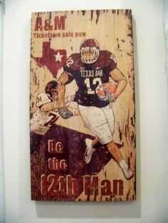 an old wooden sign with a football player on it's face and the words, texas san