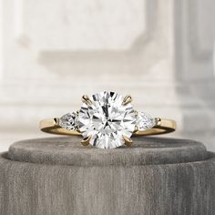 an engagement ring with three diamonds on top