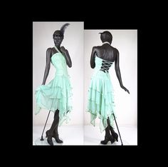 "Description  A beautiful 1920s style flapper strapless blue green chiffon handkerchief dress.  The dress has a ruched and boned bodice with vertical ribbon trim that laces up in the back and goes to a defined drop waist. The skirt is made up of 3 layers of chiffon and a matching slip that extends up and also lines the bodice, with a centre back zip, a ribbon bow on each hip with long tails, and pointed handkerchief ends around the hem.  The skirt is made with chiffon edged in matching satin rib Fitted Flapper Dress For Summer Costume Party, Fitted Summer Flapper Dress For Cocktail, Fitted Flapper Dress For Summer Cocktail, Fitted Flapper Dress For Spring Costume Party, Spring Flapper Dress For Costume Party, Fitted Summer Cocktail Flapper Dress, Fitted Summer Flapper Dress For Evening, Fitted Green Flapper Dress For Party, Elegant Spring Flapper Dress For Costume Party