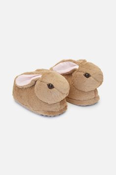 a pair of brown slippers with bunny ears