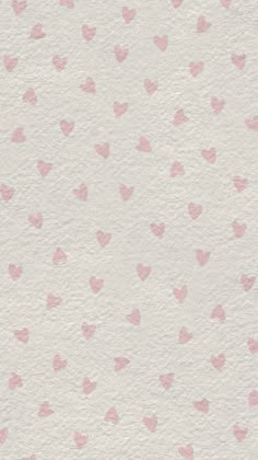 pink hearts on white paper with watercolor effect in the middle and light pink dots at the bottom