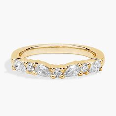 a yellow gold band with five pear shaped diamonds