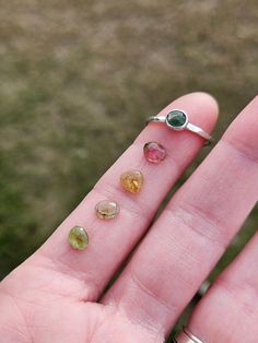 This gorgeous stackable ring features a beautiful little tourmaline gemstone set in a handcrafted bezel cup sitting atop a lightly hammered argentium silver band. Best part is, you get to choose your own stone! You let me know which stone you prefer from 1-4 and I'll make you a ring that looks like the example, but with the stone of your choice. You get to be part of the creative process with me! Gemstones measure between 5x6mm-5x7mm Follow this link to enter my shop: https://www.etsy.com/shop/barebranchjewelry Follow these links to see some of my other gemstone pieces: Teal moss kyanite: https://barebranchjewelry.etsy.com/listing/1267901671/moss-kyanite-ring-celestial-silver Herkimer diamond stacker: https://barebranchjewelry.etsy.com/listing/729433702/herkimer-diamond-ring-silver-solitai Tourmaline Birthstone Jewelry For Promise Ring, Tourmaline Birthstone Gemstones As Gift, Stackable Tourmaline Jewelry For Anniversary, Round Stackable Tourmaline Jewelry, Stackable Round Tourmaline Jewelry, Tourmaline Birthstone Ring Gift, Tourmaline Birthstone Rings For May, Stackable Tourmaline Jewelry As Gift, Stackable Tourmaline Jewelry Gift