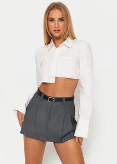 Achieve an effortlessly sophisticated look with this white crop shirt from our collection. Featuring a long sleeve lapel neck and front pocket, it's finished with an asymmetrical hem for an air of modernity. Crafted with luxurious fabrics, it will elevate any outfit, adding a touch of elegance. Material:90% Polyester, 10% Spandex Chic Cropped Shirt With Pockets For Work, Chic Button-up Cropped Shirt With Pockets, Chic Cropped Button-up Shirt With Pockets, Modern Long Sleeve Cropped Shirt For Work, Chic Cropped Shirt With Pockets, Modern Cropped Long Sleeve Shirt, Chic Cropped Shirt For Office, Spring Office Cropped Shirt With Long Sleeves, Fitted Cropped Shirt For Office