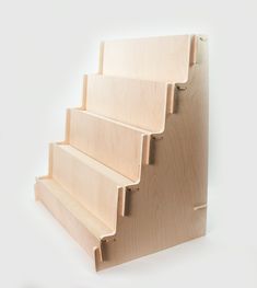 a set of stairs made out of plywood on a white background with no people