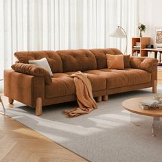 a living room with a couch, coffee table and bookshelf