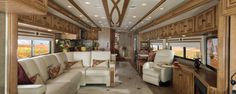 the inside of a motor home with couches and chairs