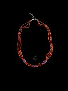 Featuring carnelian and amethyst gemstones as well as sterling silver, this one-of-a-kind necklace is a reproduction of an ancient Minoan piece. It is ethically handcrafted in my tiny silversmithing studio. Three elongated melon shaped beads, at the center of this necklace, are carved from natural high quality amethyst gemstone. These are reproductions of the ancient beads. The design is completed by stringing these large beads together with bicone and sphere shaped natural carnelian beads on triple strands of waxed nylon cord, which is a very durable material. At both ends of the necklace there is hook and eye closures handmade of sterling silver.  The steering silver extension chain allows you to adjust the length of this piece in accordance with your personal preference.  This one-of-a- Traditional Orange Gemstone Jewelry, Traditional Carnelian Gemstone Necklaces, Traditional Carnelian Gemstone Jewelry, Traditional Carnelian Gemstone Beads, Spiritual Carnelian Oval Beads Jewelry, Spiritual Oval Carnelian Bead Jewelry, Traditional Carnelian Beads For Gift, Traditional Carnelian Beads As A Gift, Spiritual Carnelian Gemstone Beads Jewelry