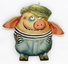 a pig with a hat and overalls is hanging on a wall ornament