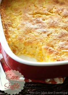 a casserole dish filled with cornbread and topped with melted cheese on top