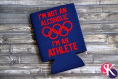 i'm not an alcoholic i'm an athlete flask cover with the olympic symbol on it